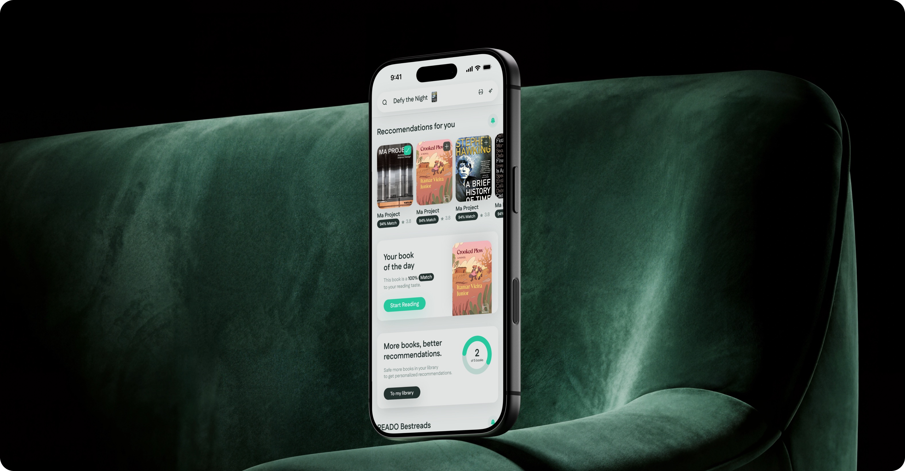 Phone on a dark green armchair showing the Reado discovery feed